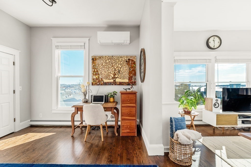 5 Babson Street, Unit 2 Gloucester, MA 01930 - Photo 9 of 30 a dining room with furniture wooden floor and a rug