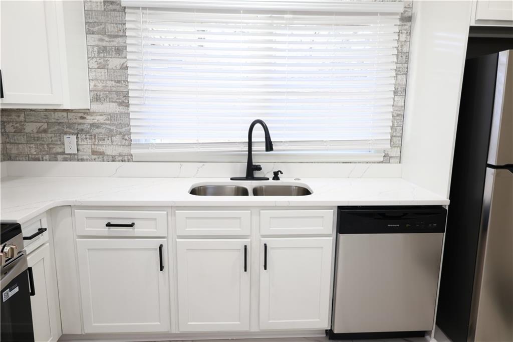 1876 Sandtown Road Southwest Atlanta, GA 30311 - Photo 3 of 20 a close view of a sink and a vanity
