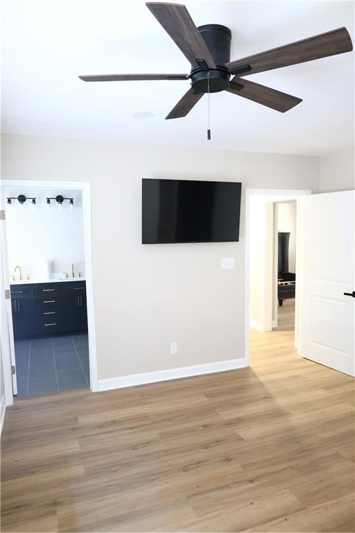 1876 Sandtown Road Southwest Atlanta, GA 30311 - Photo 7 of 20 a view of a big room with wooden floor and cabinet