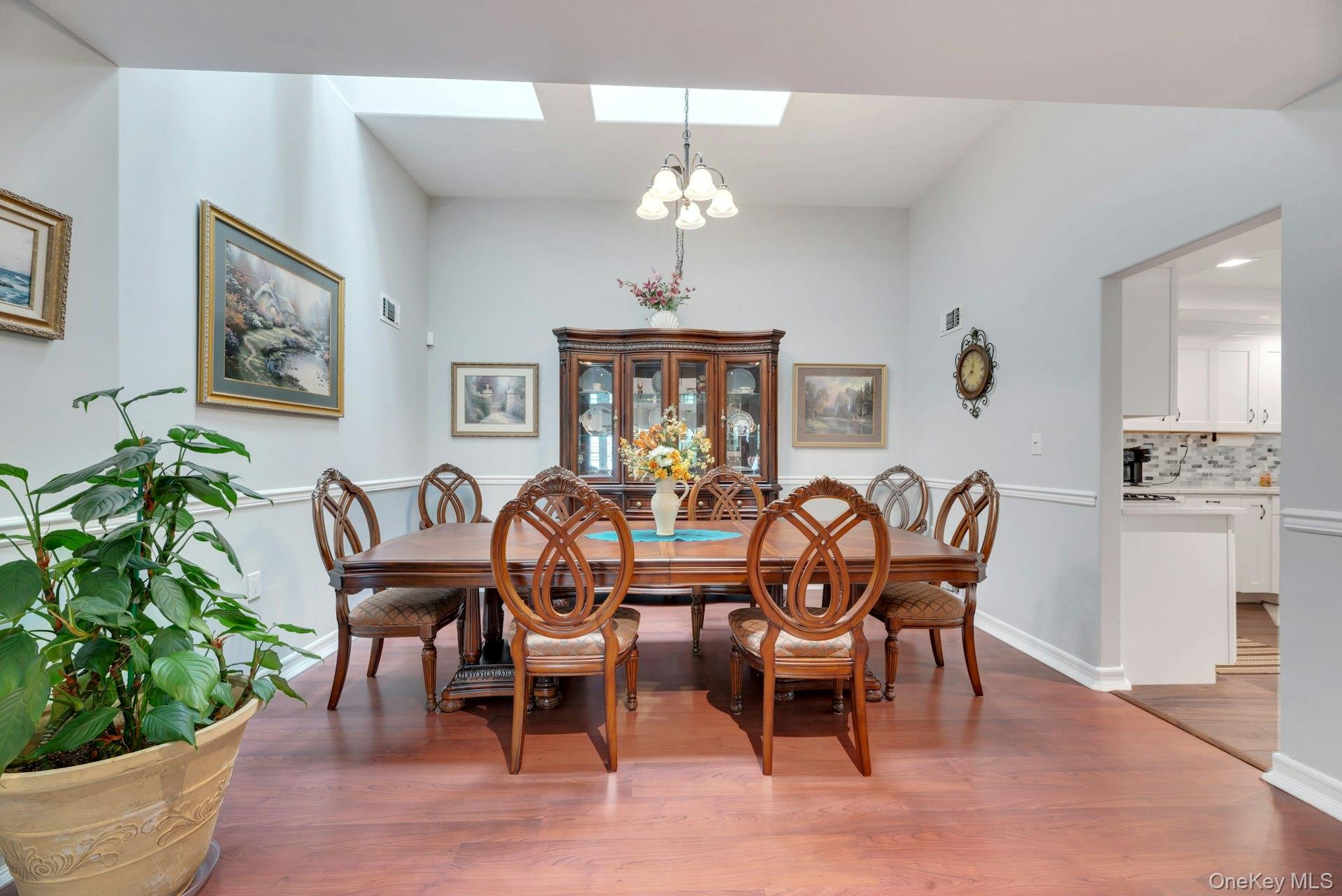 104 Glen Drive Ridge, NY 11961 - Photo 10 of 25 a view of a dining room with furniture window and wooden floor