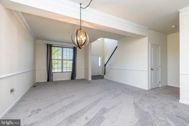 a kitchen with granite countertop stainless steel appliances and wooden cabinets