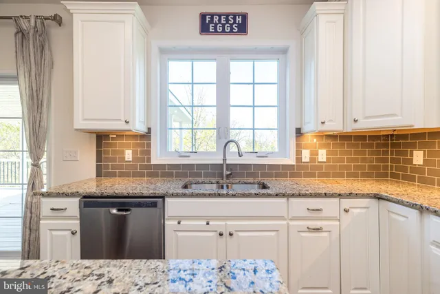 a living room with a fireplace and a flat screen tv