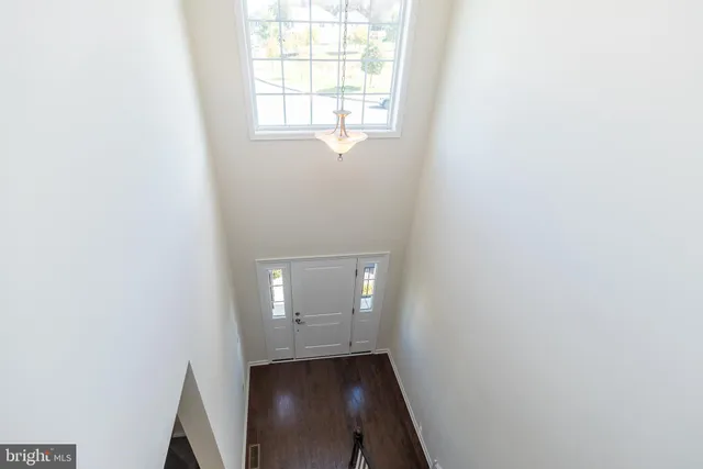 a white bath tub sitting in a bathroom next to a window