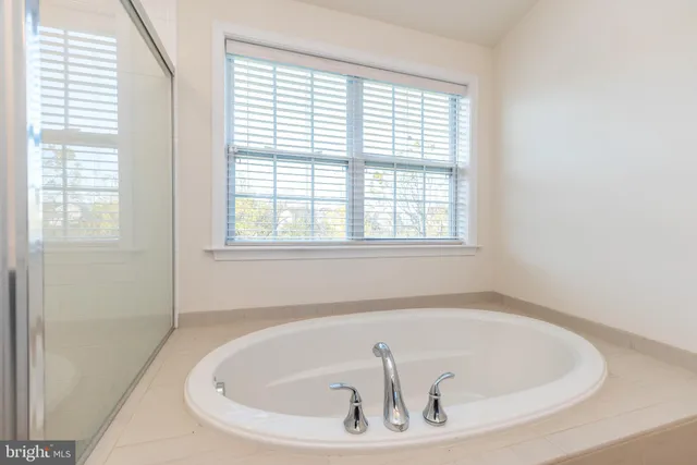 a front view of house with yard and trees