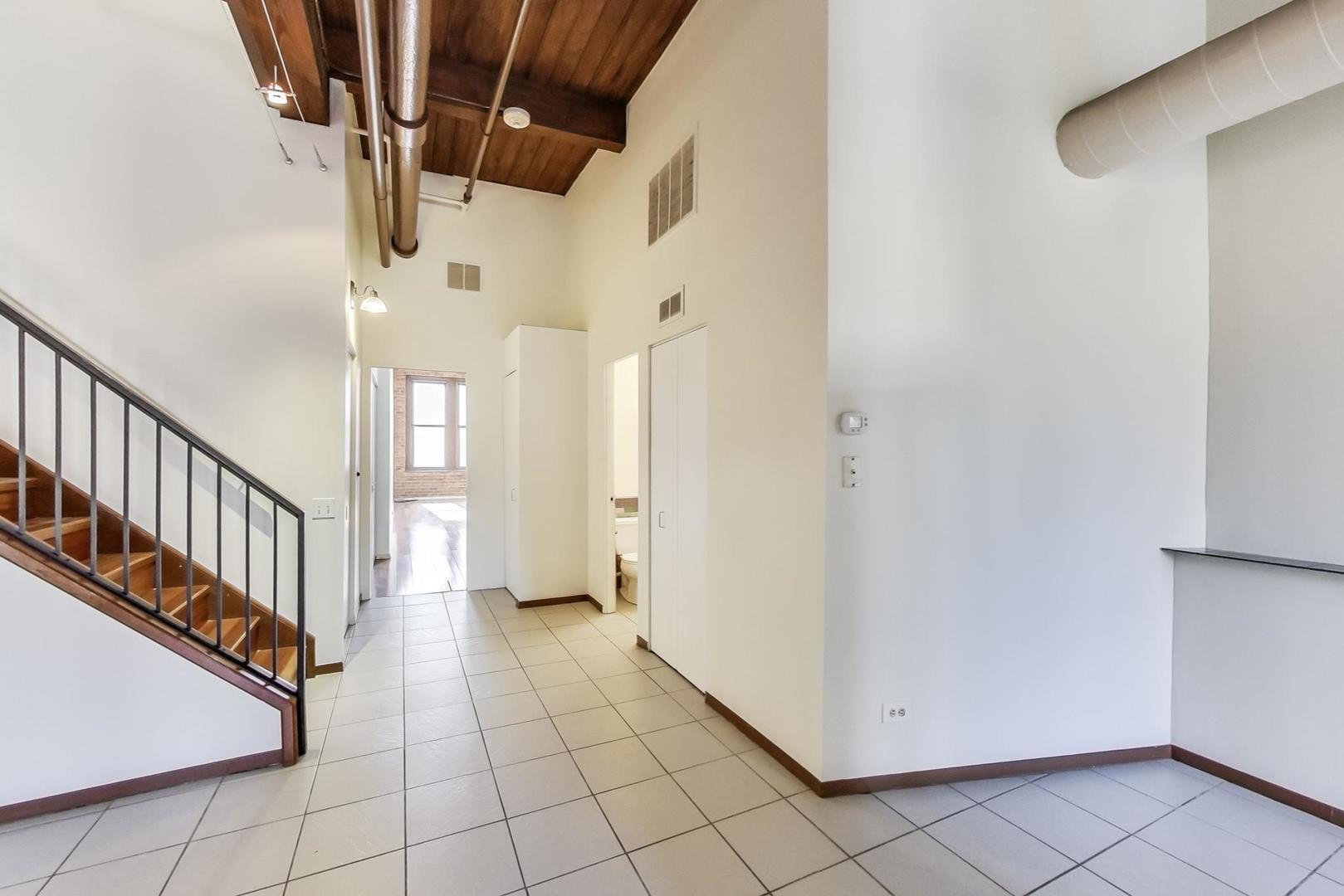 331 South Peoria Street, Unit 502 Chicago, IL 60607 - Photo 14 of 32 a view of a hallway with entryway