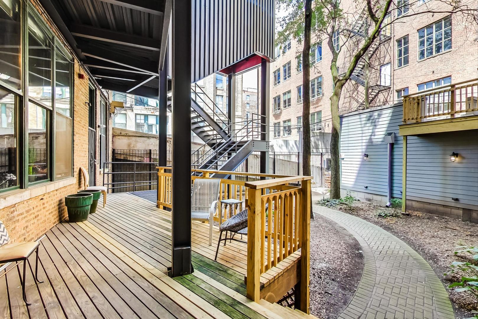 331 South Peoria Street, Unit 502 Chicago, IL 60607 - Photo 30 of 32 a view of balcony with wooden floor and fence