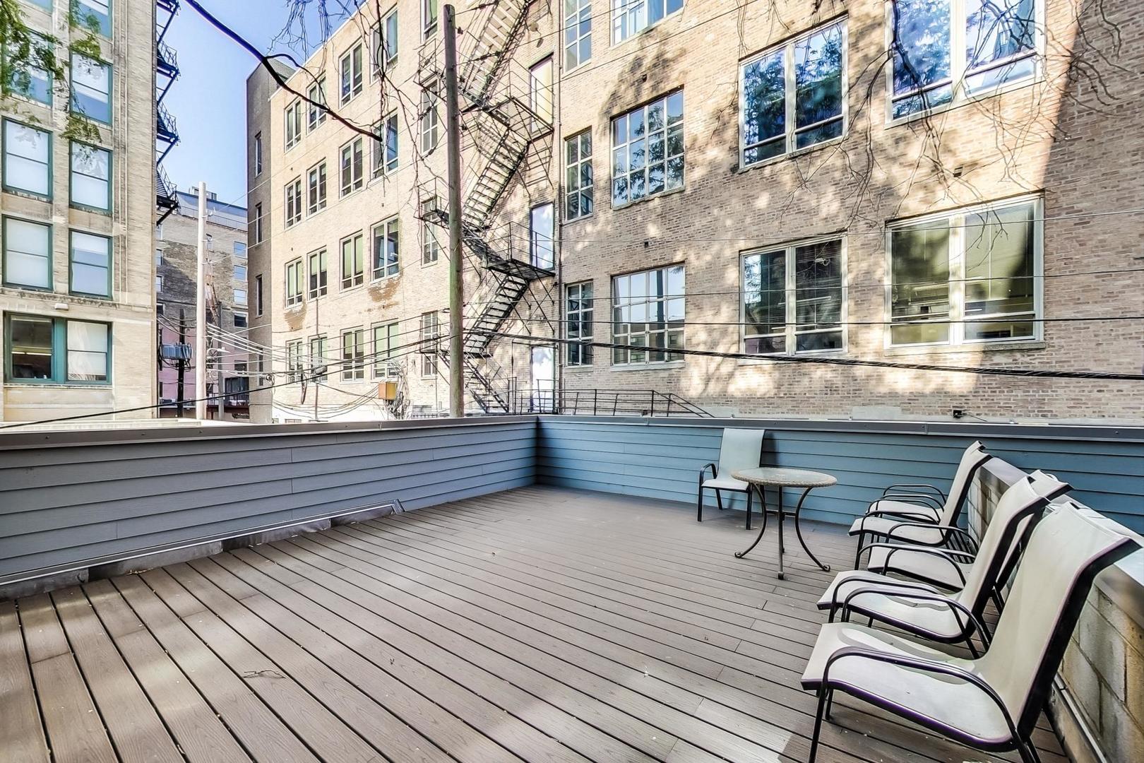 331 South Peoria Street, Unit 502 Chicago, IL 60607 - Photo 31 of 32 a view of a chairs on the roof deck