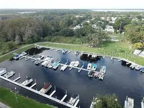 an aerial view of a house with a lake view