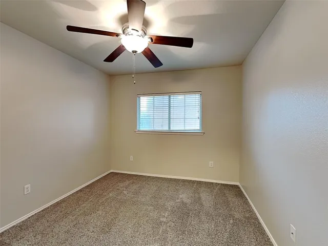 a bathroom with a sink vanity mirror and toilet