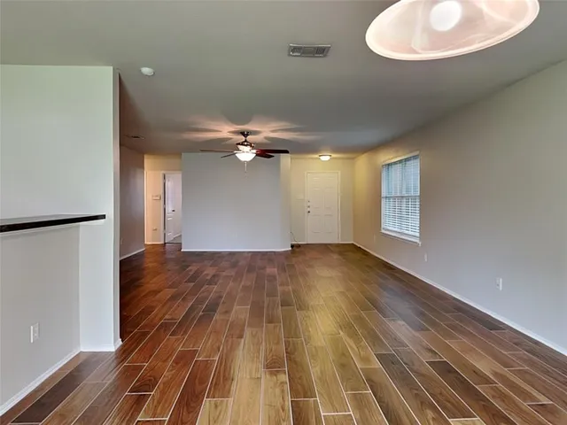 a view of a livingroom with wooden floor