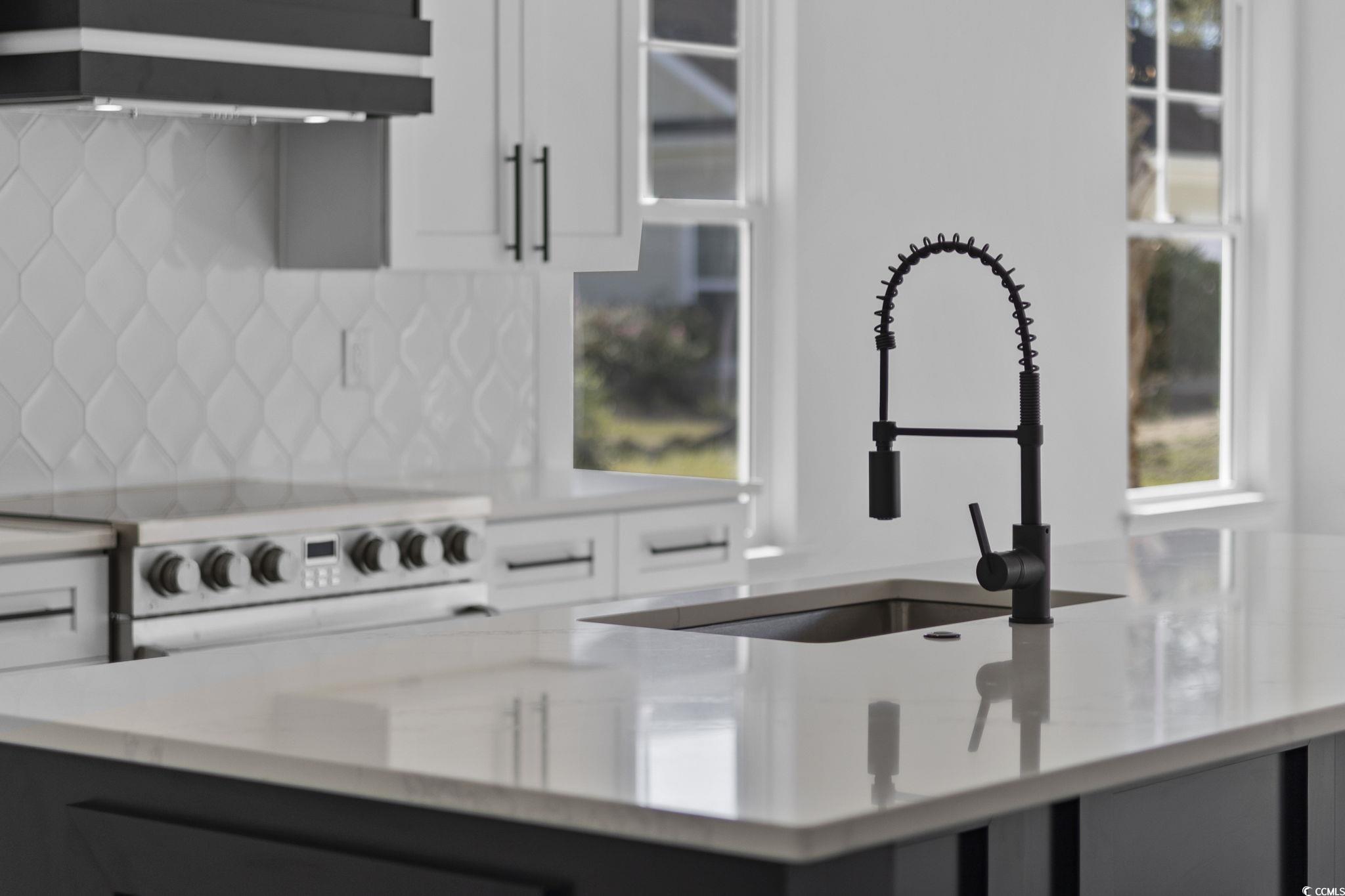 125 Lac Courte Myrtle Beach, SC 29579 - Photo 17 of 40 Kitchen featuring white cabinetry, light stone countertops, white range with electric stovetop, tasteful backsplash, and custom exhaust hood