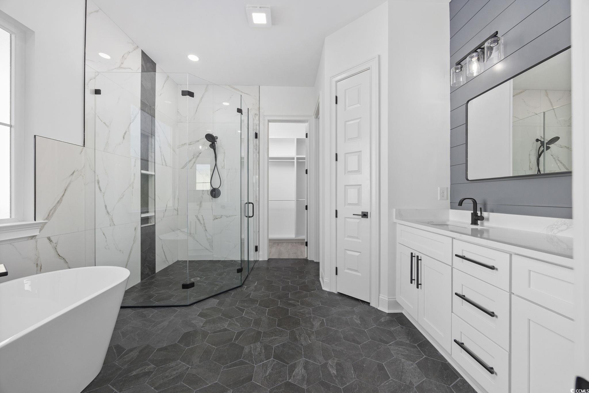125 Lac Courte Myrtle Beach, SC 29579 - Photo 23 of 40 Bathroom featuring a soaking tub, vanity, a marble finish shower, and recessed lighting