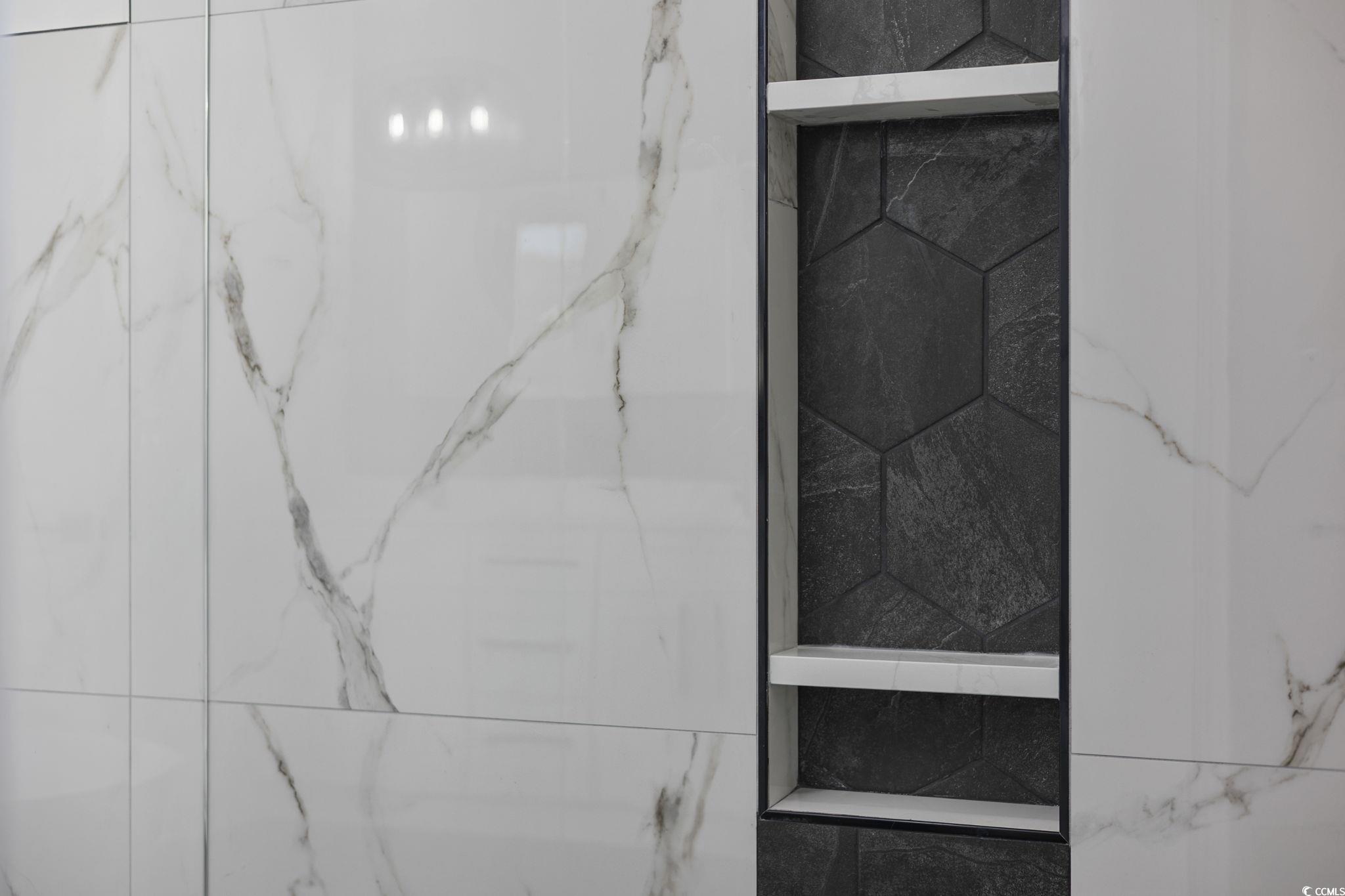 125 Lac Courte Myrtle Beach, SC 29579 - Photo 25 of 40 Bathroom view of a marble finish shower