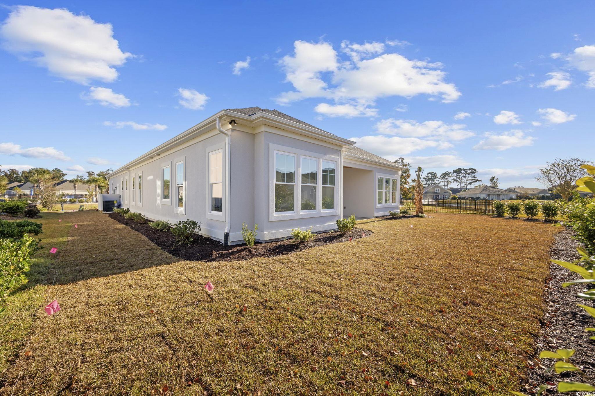 125 Lac Courte Myrtle Beach, SC 29579 - Photo 37 of 40 View of side of property with stucco siding