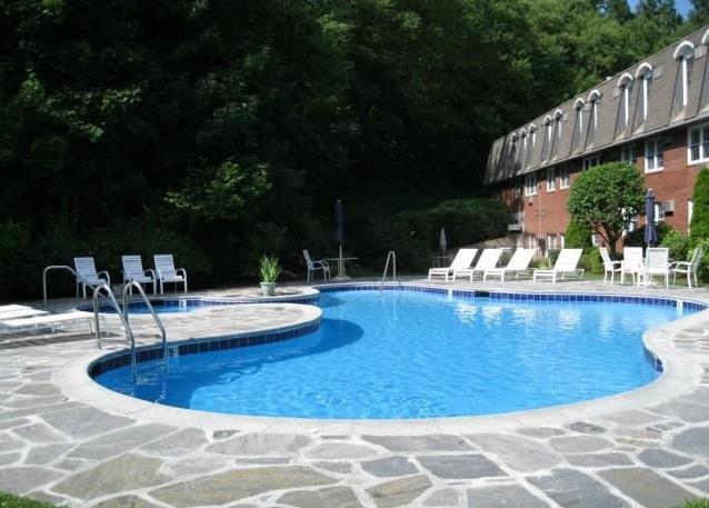34 Padanaram Road, Unit 315 Danbury, CT 06811 - Photo 1 of 1 a view of a swimming pool with a patio