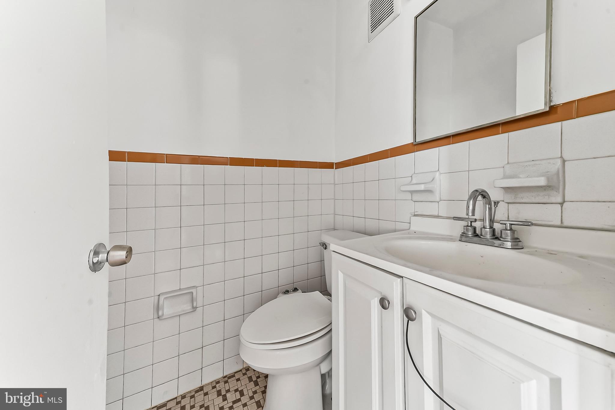 7269 Walnut Street Upper Darby, PA 19082 - Photo 13 of 17 a bathroom with a sink a toilet and shower