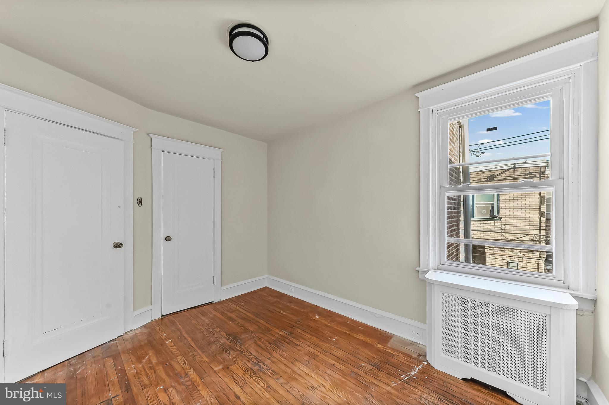 7269 Walnut Street Upper Darby, PA 19082 - Photo 6 of 17 a view of empty room with wooden floor