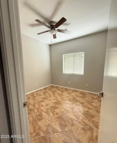 a view of an empty room and a window