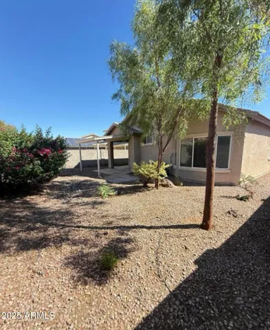 a view of a backyard with potted plants