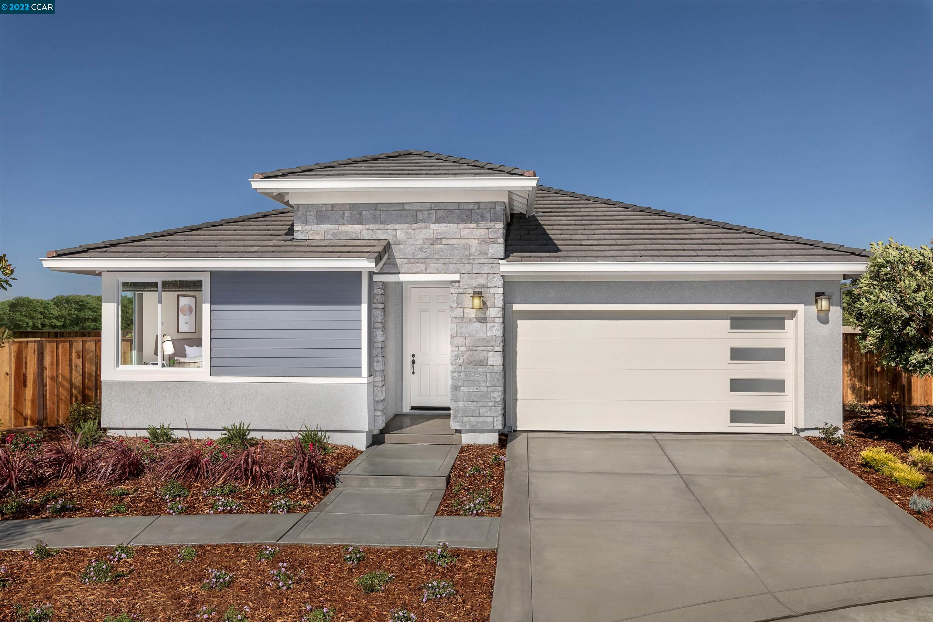San Joaquin County Manteca, CA 95337 - Photo 1 of 1 a front view of a house with a yard