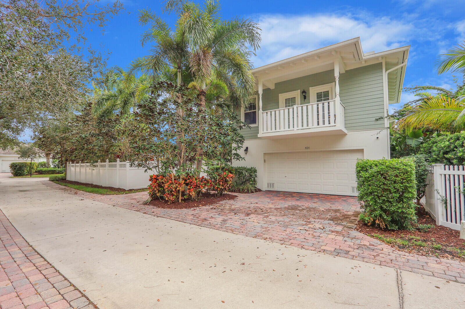 101 St Pierre Way Jupiter, FL 33458 - Photo 57 of 57 front view of a house with potted plants