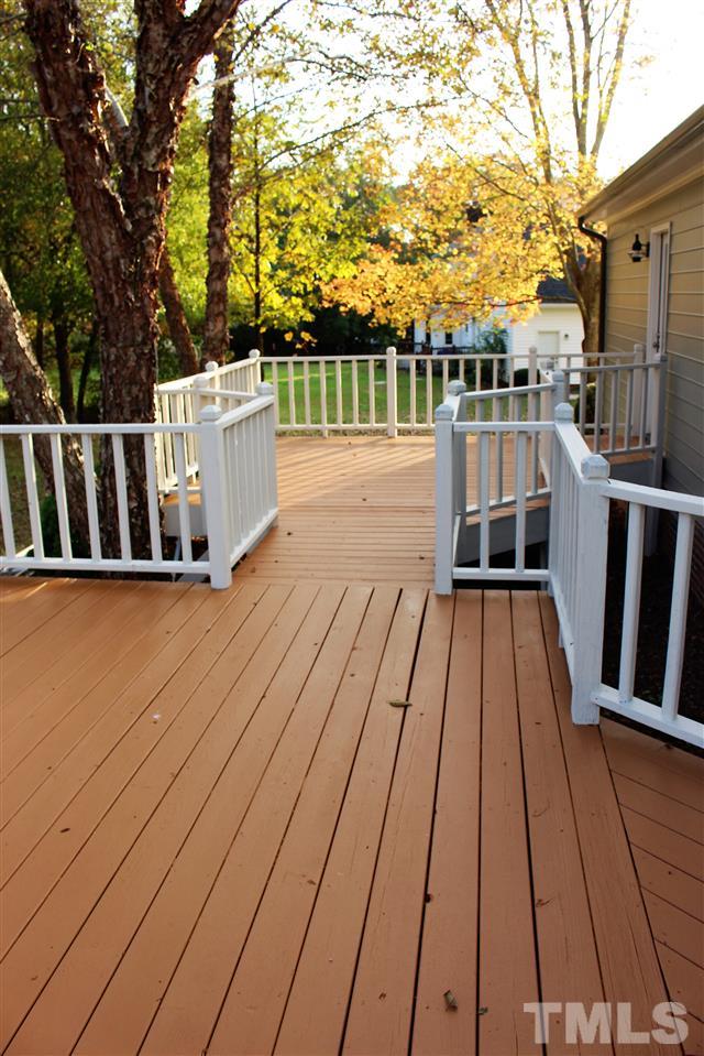 5933 Hampton Ridge Road Raleigh, NC 27603 - Photo 22 of 23 a view of balcony with wooden floor and fence