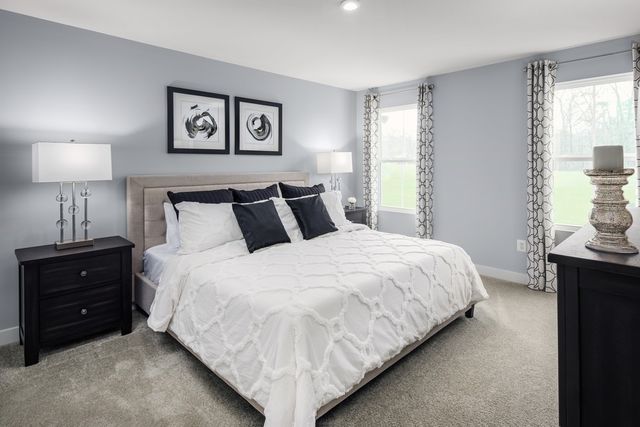 a kitchen with a refrigerator a sink and dishwasher with wooden floor