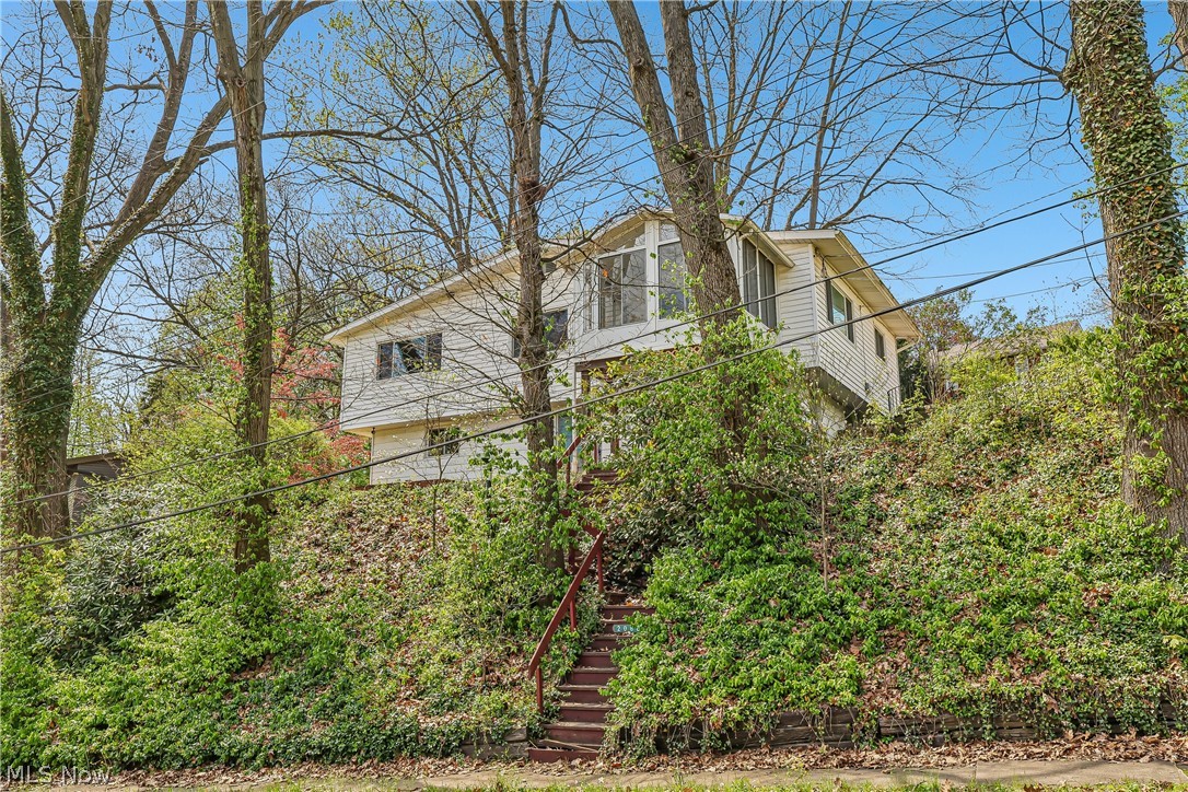 Front of property with a stairway