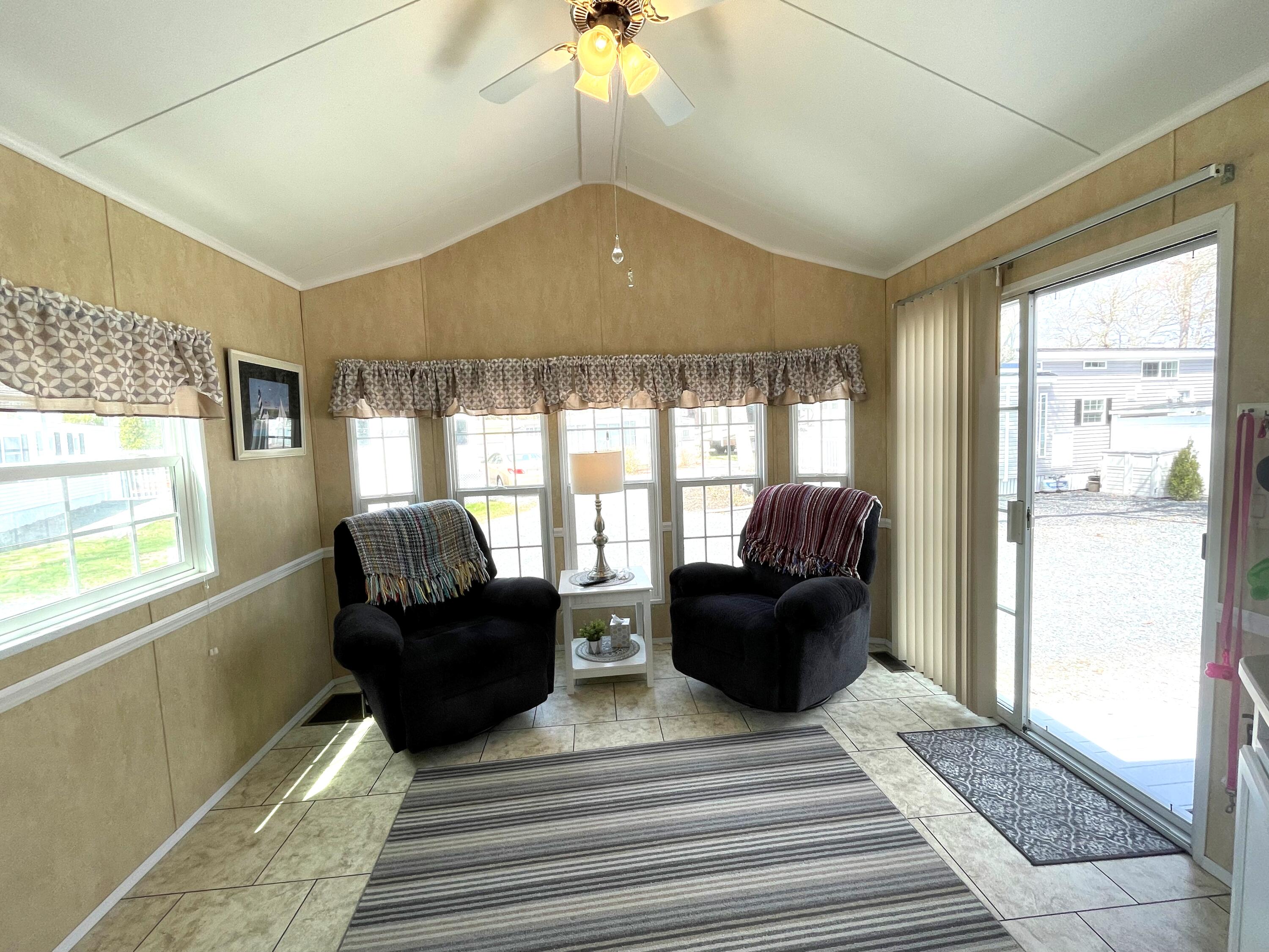 184 Old Wharf Road, Unit G05 Dennis Port, MA 02639 - Photo 7 of 17 a living room with furniture and a window