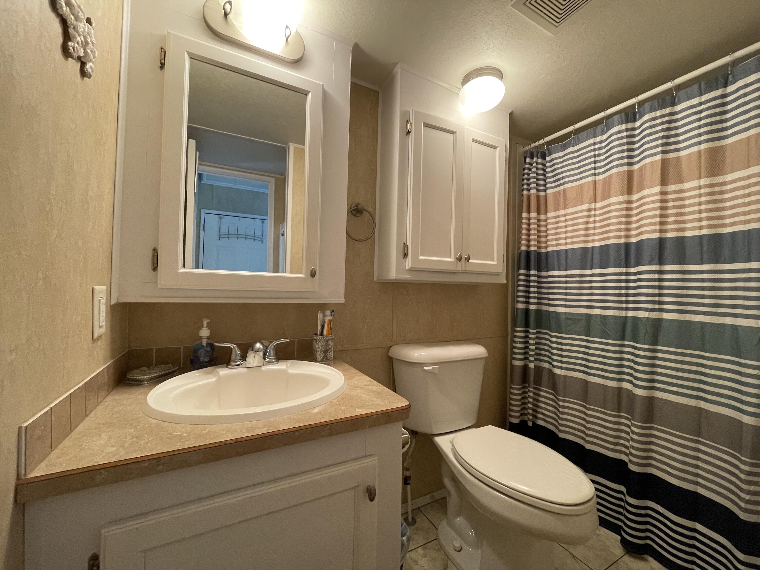 184 Old Wharf Road, Unit G05 Dennis Port, MA 02639 - Photo 10 of 17 a bathroom with a sink toilet and shower