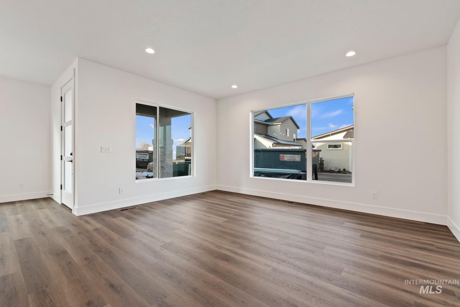 748 South Calhoun Place Star, ID 83669 - Photo 12 of 32 Unfurnished room with dark wood-style flooring and recessed lighting