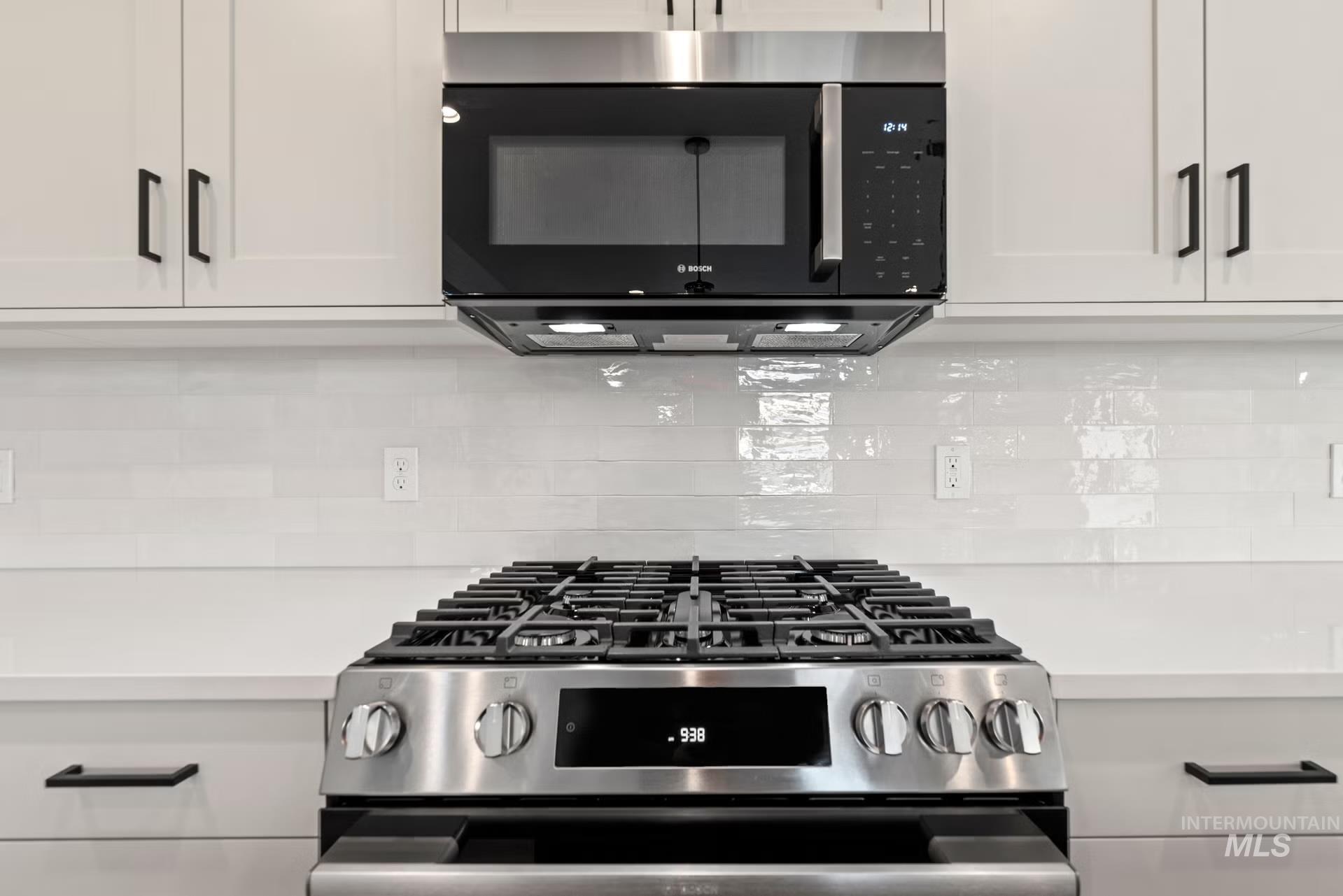 748 South Calhoun Place Star, ID 83669 - Photo 16 of 32 Kitchen view of stainless steel range with gas stovetop and white cabinets