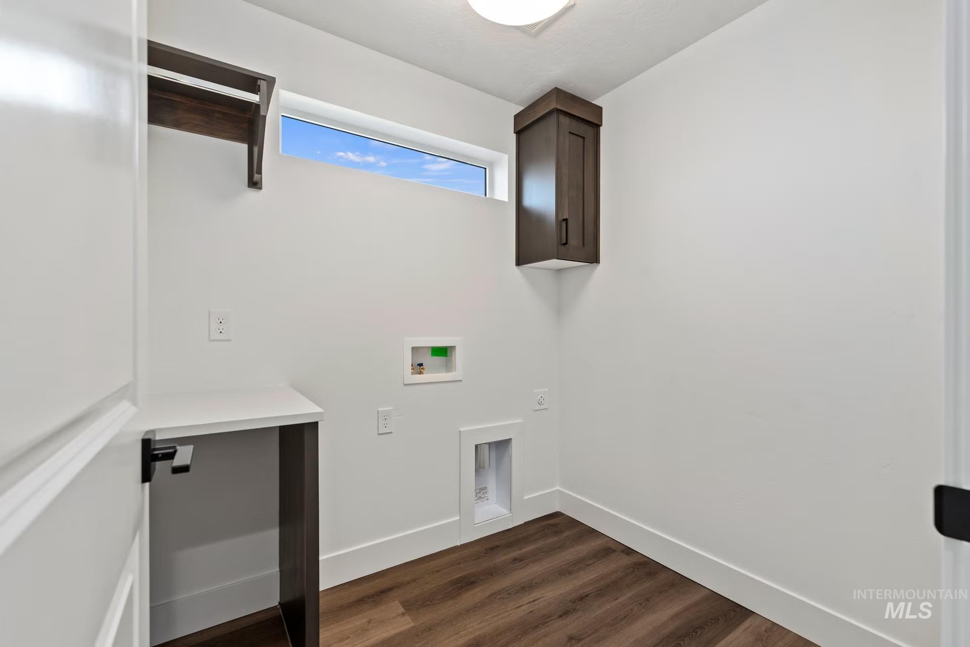 748 South Calhoun Place Star, ID 83669 - Photo 20 of 32 Laundry room featuring dark wood-type flooring and hookup for a washing machine
