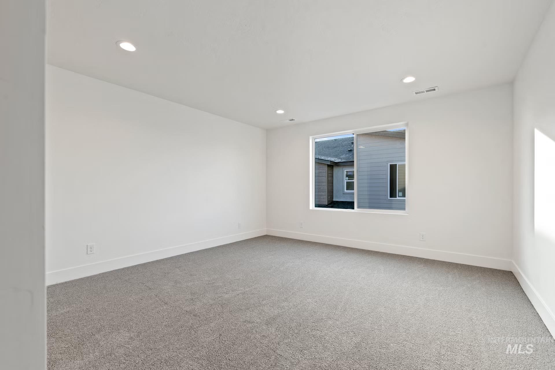 748 South Calhoun Place Star, ID 83669 - Photo 25 of 32 Unfurnished room with light colored carpet and recessed lighting