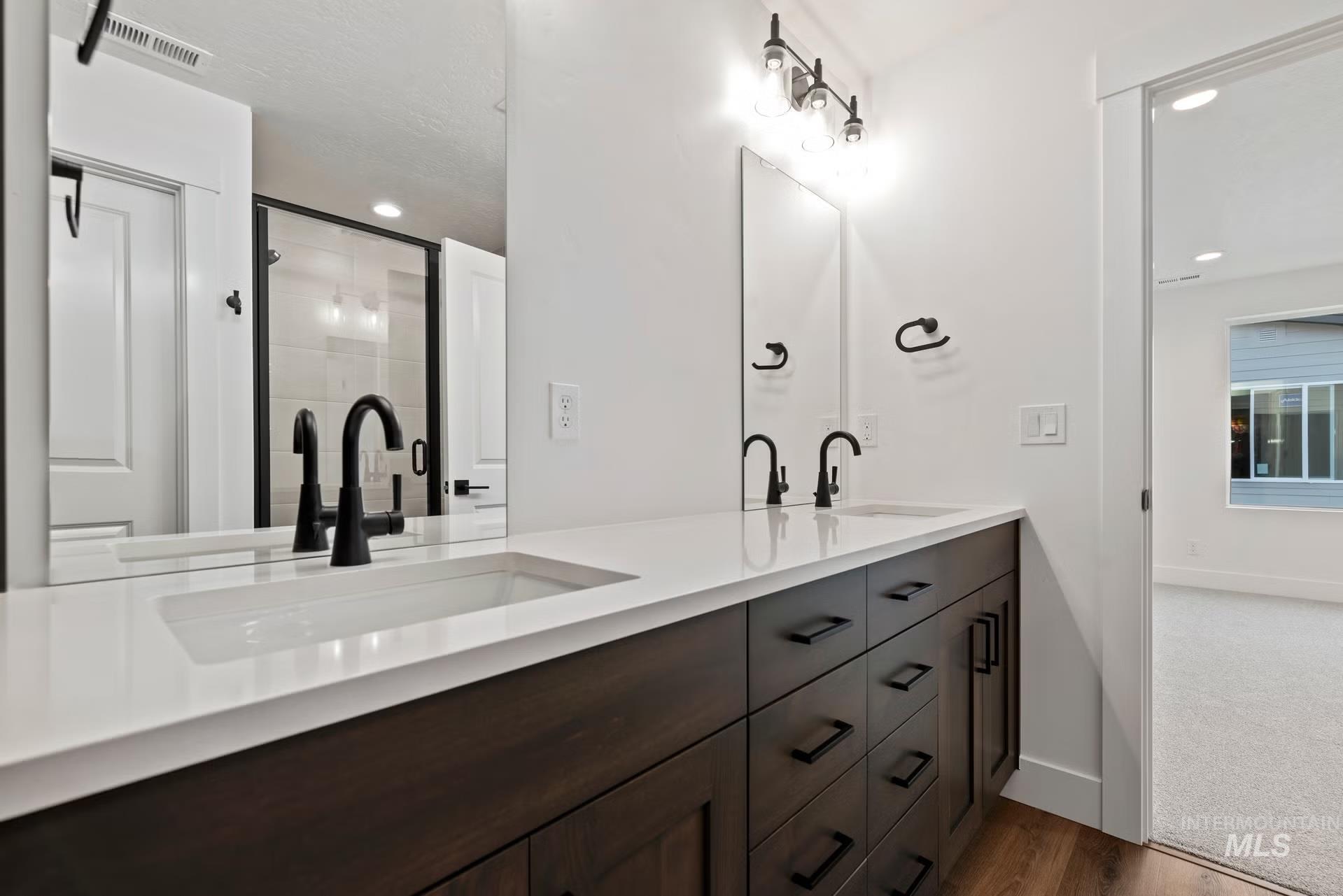 748 South Calhoun Place Star, ID 83669 - Photo 26 of 32 Full bath featuring double vanity, dark wood finished floors, and recessed lighting