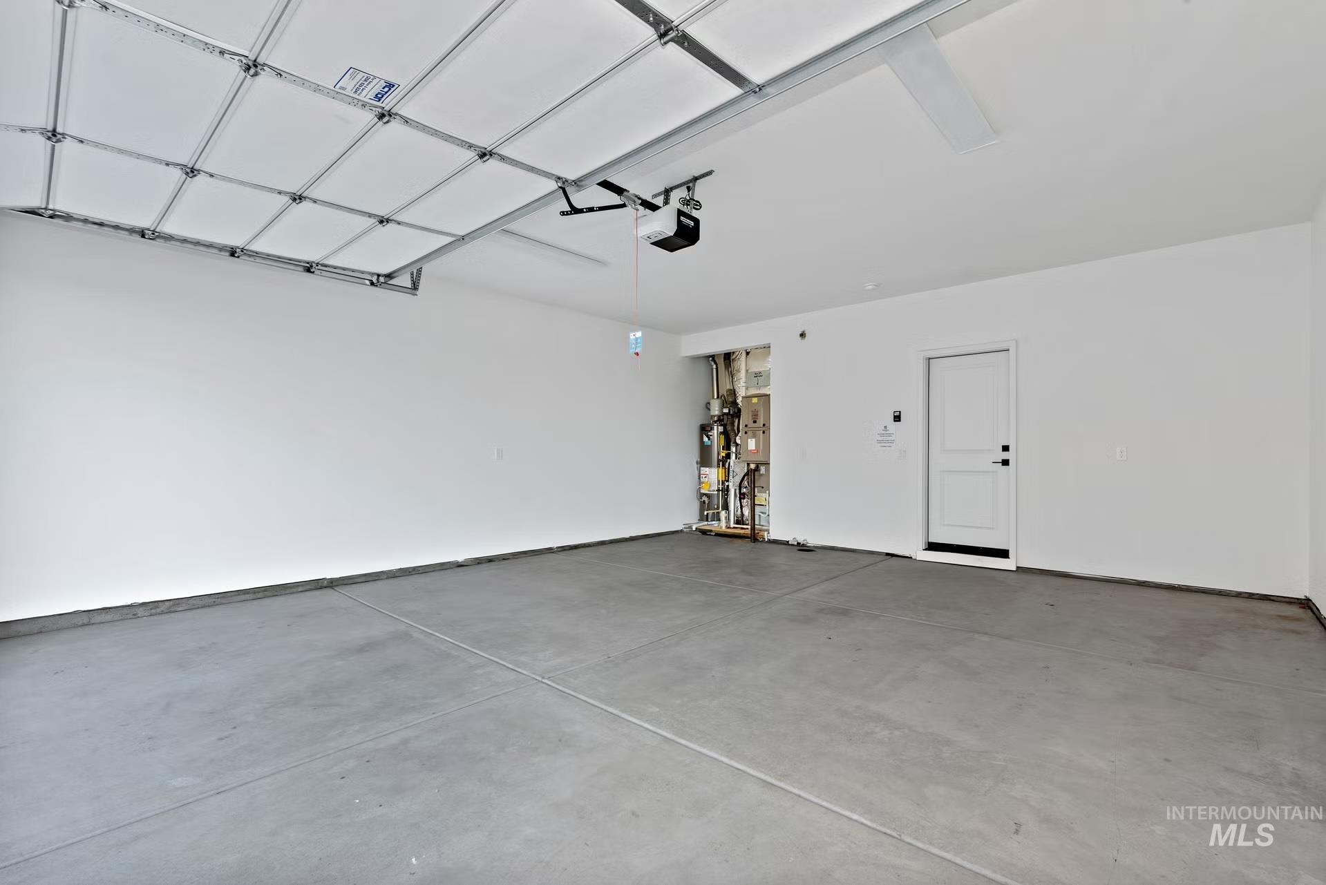 748 South Calhoun Place Star, ID 83669 - Photo 29 of 32 Garage featuring water heater