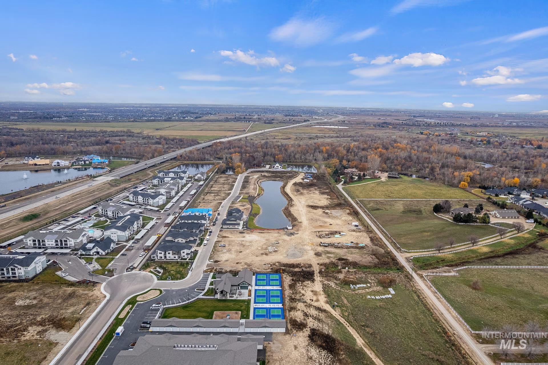 748 South Calhoun Place Star, ID 83669 - Photo 9 of 32 Aerial overview of property's location featuring a large community pond