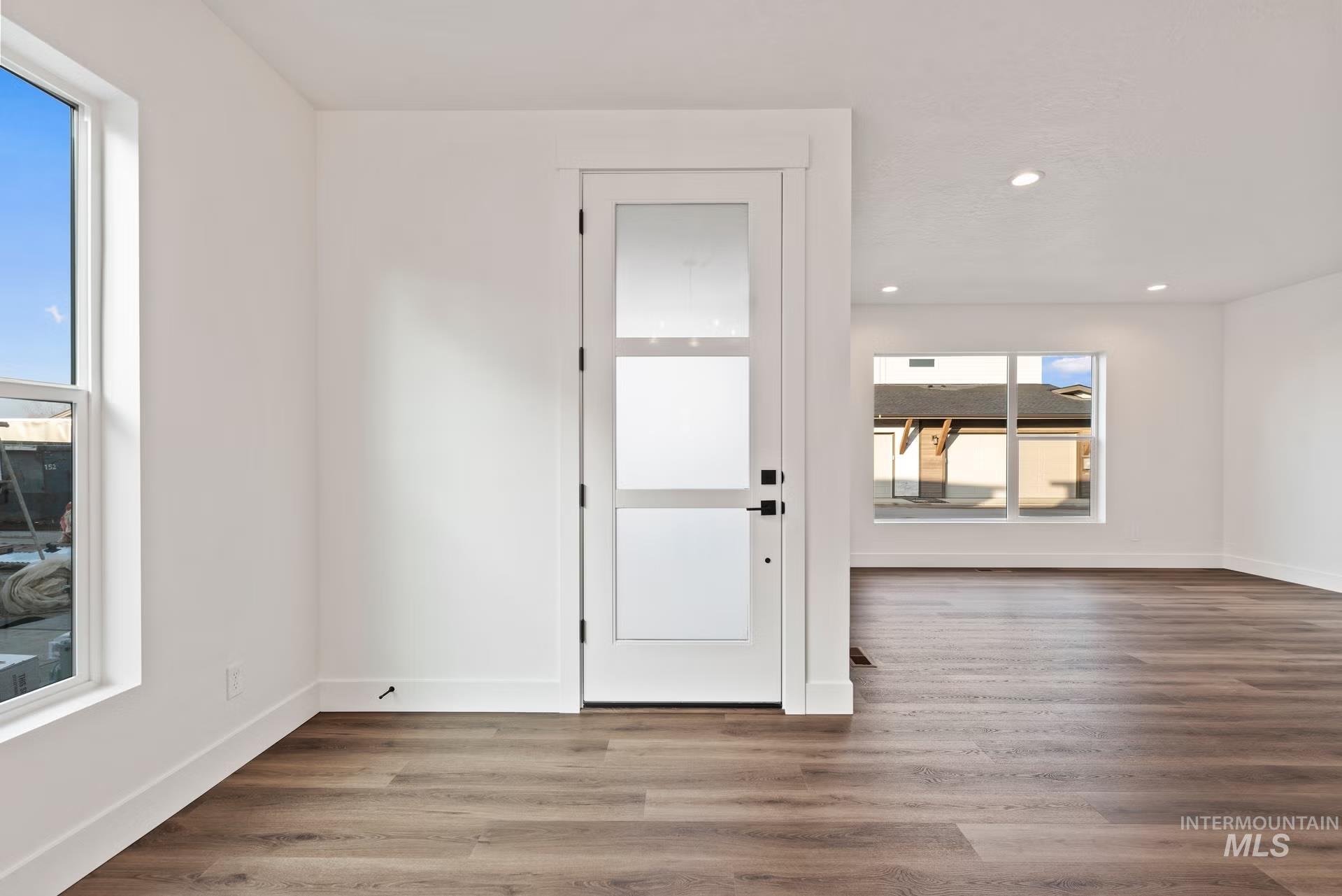 748 South Calhoun Place Star, ID 83669 - Photo 10 of 32 Foyer entrance with dark wood-style floors and recessed lighting