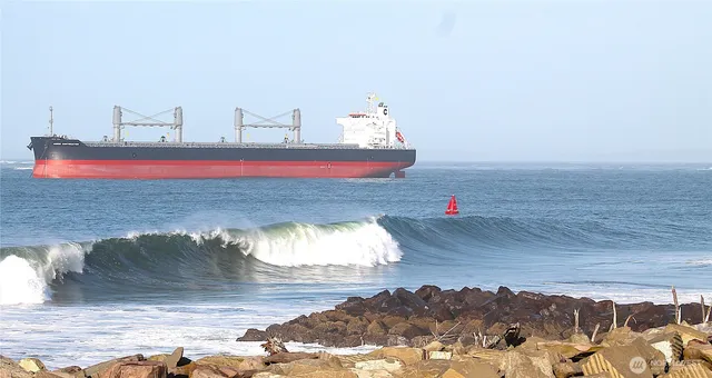 a view of a swimming pool with a table and chairs