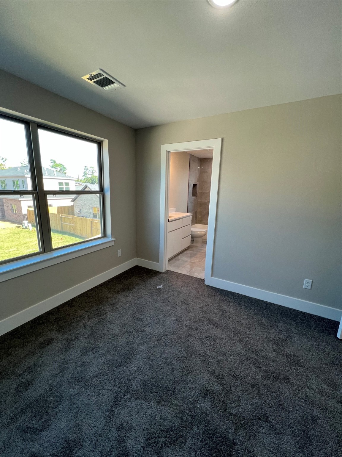 2511 Martinas Ct Spring Spring, TX 77388 - Photo 13 of 30 an empty room with large windows and mountain view