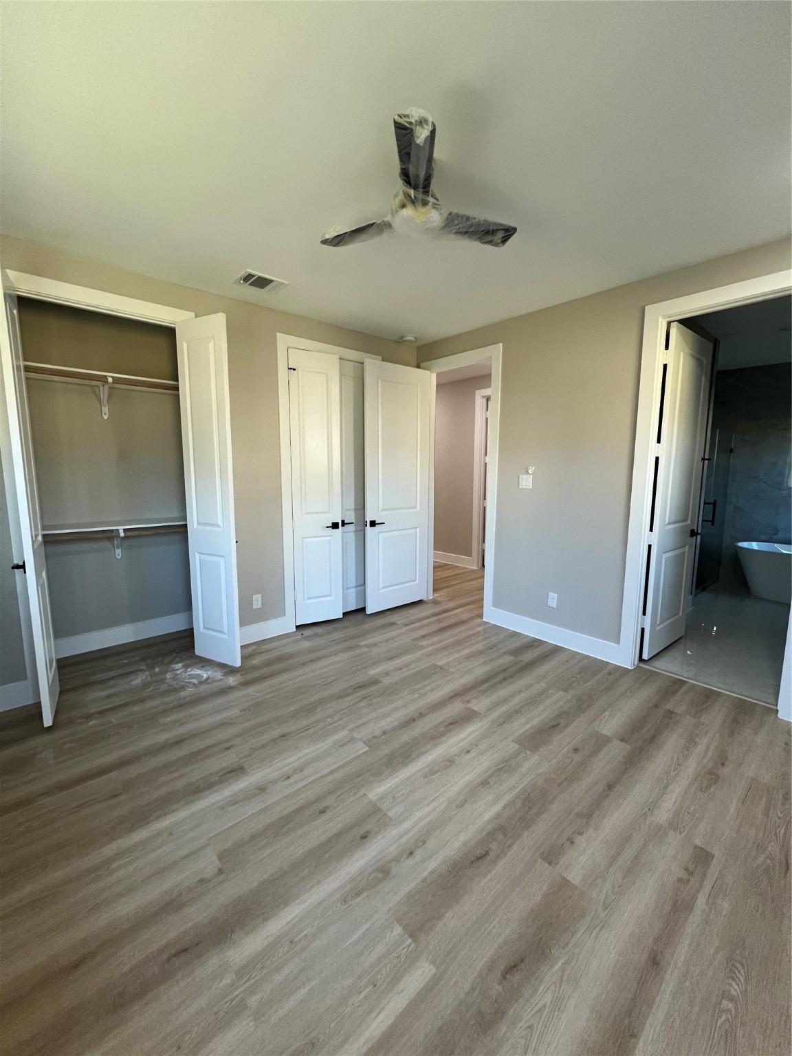 2511 Martinas Ct Spring Spring, TX 77388 - Photo 22 of 30 a view of empty room with wooden floor and fan