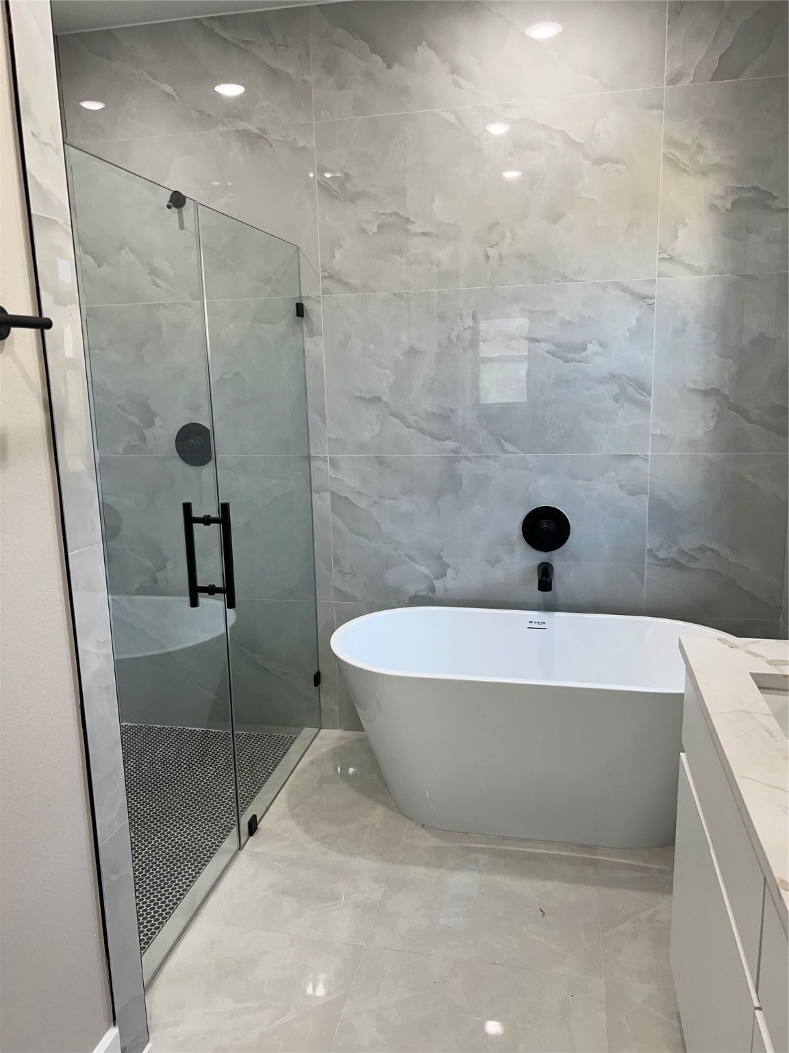 2511 Martinas Ct Spring Spring, TX 77388 - Photo 23 of 30 a bathroom with a tub and a shower