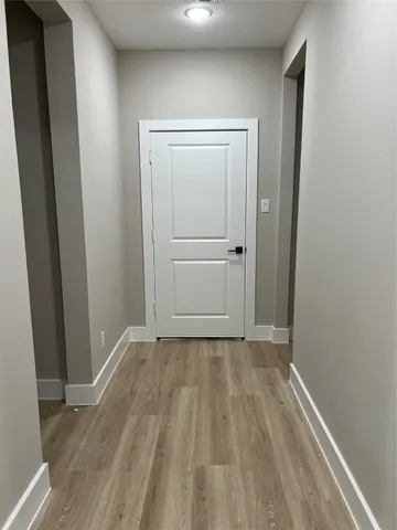 a bathroom with a double vanity sink mirror and bathtub