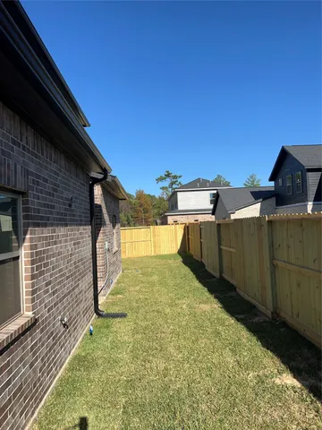 a view of a backyard of the house