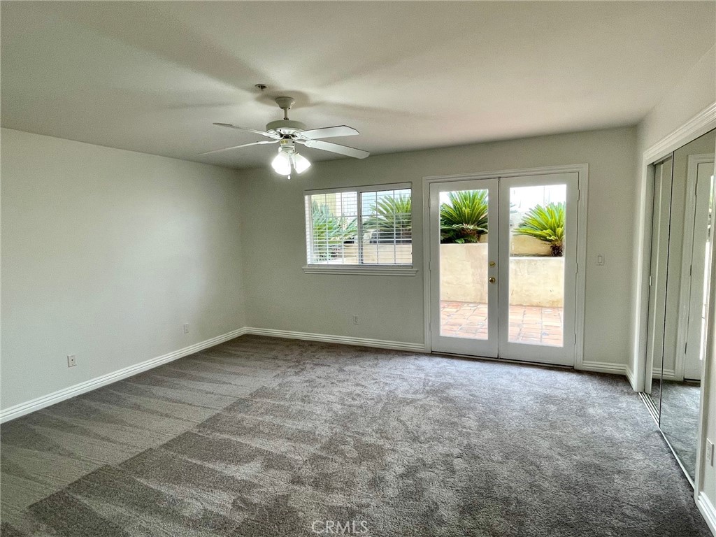 1745 Havemeyer Lane Redondo Beach, CA 90278 - Photo 14 of 20 an empty room with windows and ceiling fan