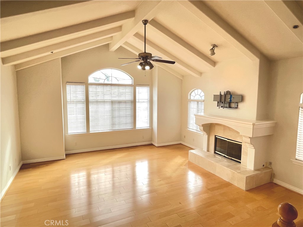 1745 Havemeyer Lane Redondo Beach, CA 90278 - Photo 4 of 20 a view of an empty room with a fireplace and a window