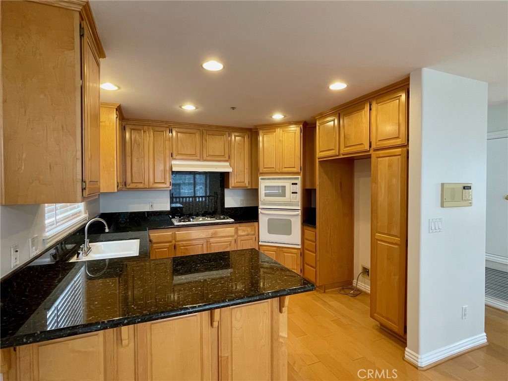 1745 Havemeyer Lane Redondo Beach, CA 90278 - Photo 7 of 20 a kitchen with stainless steel appliances granite countertop a refrigerator a stove a sink and a oven