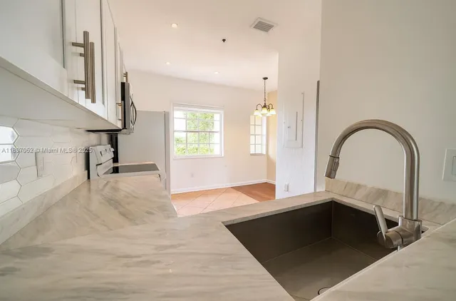 a view of a living room and entryway