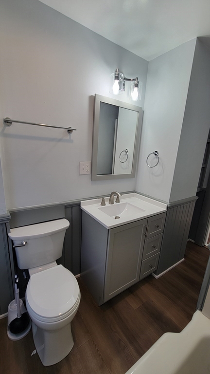30 O'Neil Street, Unit 2 Hudson, MA 01749 - Photo 12 of 28 a bathroom with a sink mirror and toilet