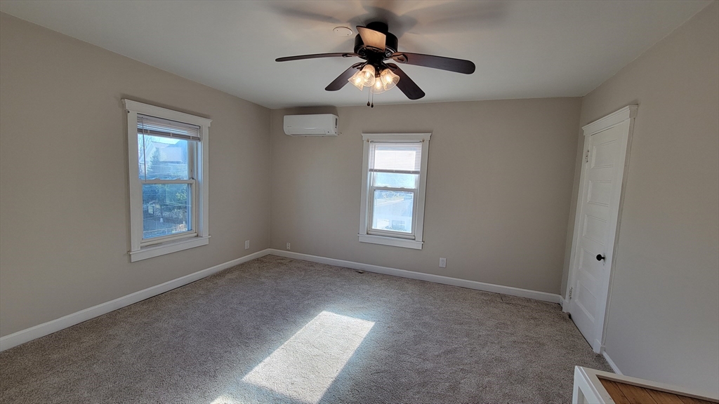 30 O'Neil Street, Unit 2 Hudson, MA 01749 - Photo 15 of 28 a view of room with window and ceiling fan